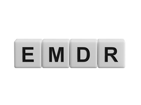 The text EMDR word Eye Movement Desensitization is written on notepad . Medical concept.close up of wooden cubes,Business Concept.Supports PNG files with transparent backgrounds.