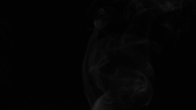 Real steam rising from boiling water against a black background. Natural water vapor movement captured in studio conditions. Not AI generated. Ideal for cooking, hot beverages, humidity, wellness, atm