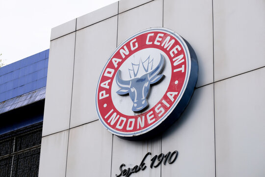 Pekanbaru, Indonesia - September 28, 2025: Padang Cement Indonesia corporate logo sign with buffalo head emblem on a building facade wall