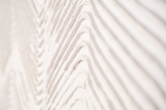 Closeup White Plaster Wall With Chevron Texture Pattern For Architectural Backgrounds