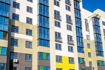 Modern Yellow and White Apartment Buildings in New Residential District Under Clear Blue Sky © Eugeniusz