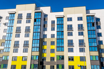 Modern Yellow and White Apartment Buildings in New Residential District Under Clear Blue Sky © Eugeniusz