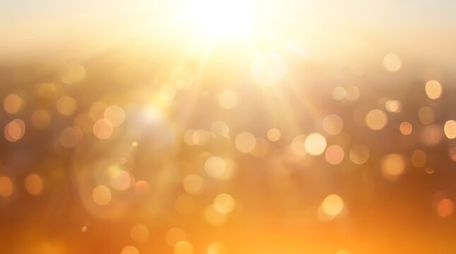 Abstract golden background with soft bokeh lights and sun flare effect