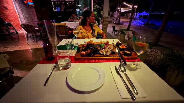 Seafood Platter On A Wooden Board Served By The Beachfront Restaurant. - forward shot