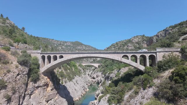 Pont du Diable Bridge Spanning Verdant Gorge in Occitanie, France