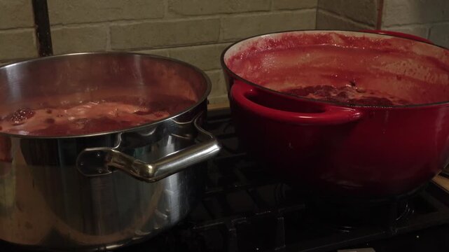 Boiling Sweet Strawberry Confiture in Large Cooking Pot on Range
