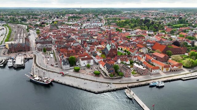 Aerial footage of harbor and waterfront cityscape, Helsingor city, Denmark