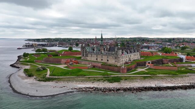 Drone shot of Kronborg Castle landmark over moat and sea, Helsingor, Denmark