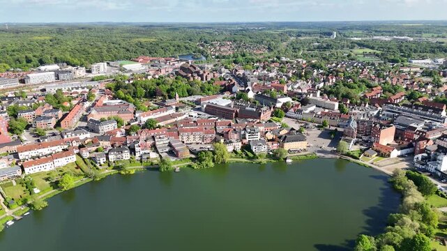 Drone shot over lake and town center, Hillerod, Denmark