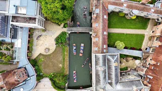Bird's-eye view of punting boat tour under Mathematical Bridge, Cambridge, UK