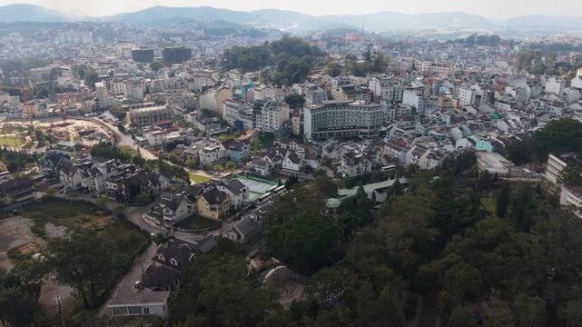 Vietnam, Da Lat Compact City Blocks And Narrow Streets. Concentrated Downtown Area Featuring Buildings And Alleyways. Urban Hotel Cluster In Da Lat Characterized By Rooftops And Mazelike