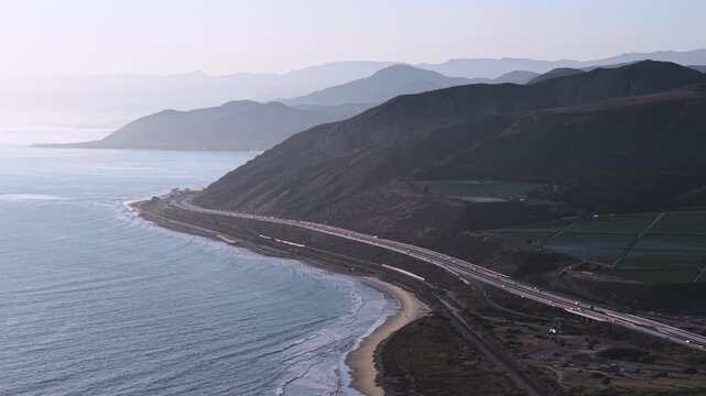 Coastal Highway drives along ocean Mountains. PCH Highway heading Northbound from Ventura CA.