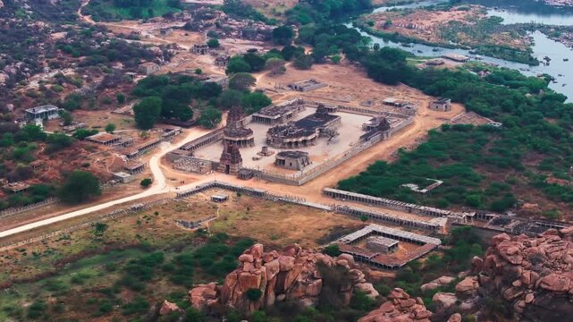 Maha Mantapa with musical pillars, Vitthal Mandirv, The Stone Chariot and Tungabhadra river at nimbapura, hampi, karnataka, india. day time, zib shot, drone shot, 4k.