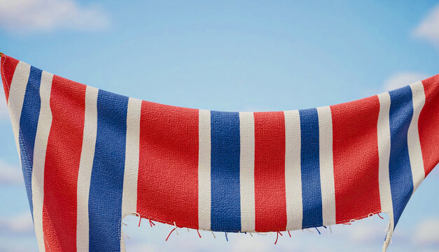 Red White Blue Bunting Fabric Against Sky with Copy Space