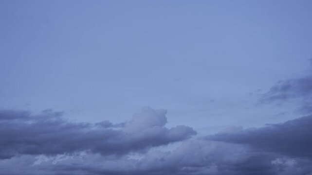 Time-lapse video of a dreamy sunset sky with clouds
