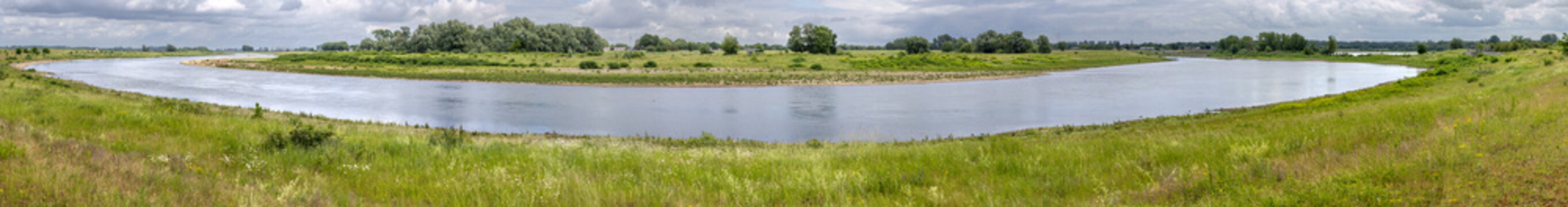 Panoramic view on a bend of the River Meuse in the Maas valley river park on the Netherlands Belgium border, designed for water storage and nature restoration