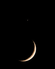 A waxing crescent moon with the planet Venus above © Jon Ingall