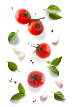 Fresh  Italian, green organic basil leaves garlic and tomatoes isolated on white background. Transparent background and natural transparent shadow; Ingredient, spice for cooking. collection for design
