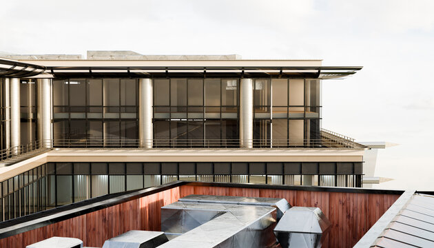 Modern building facade with glass windows and metal rooftop details. Illustration, rendering