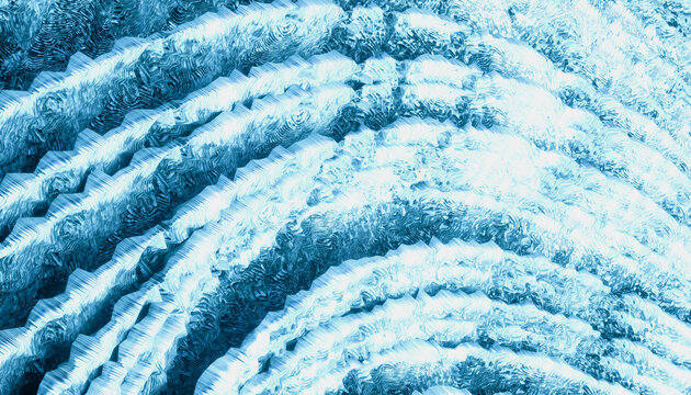 A close-up abstract pattern of layered, blue-tinted, textured waves.