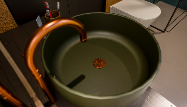 Copper faucet and green sink with toothbrushes and a coin in a modern bathroom setting.
