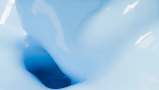 Close-up of swirling blue liquid creating abstract shapes and dynamic flow.