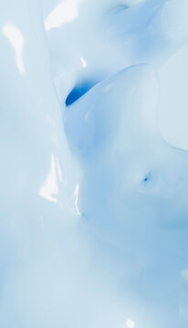 Abstract close-up of glossy white and blue fluid texture with a smooth appearance.