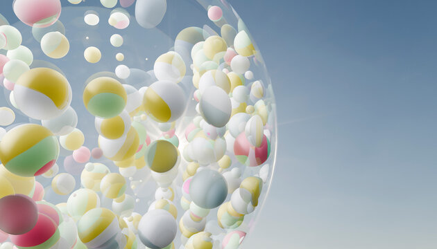 Spheres of pastel colors in a large transparent container against a blue sky backdrop.