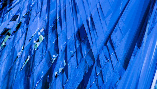 Abstract blue geometric pattern with sharp angles and dynamic lines.