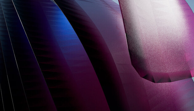Abstract close-up of a purple and blue geometric metallic surface with light reflections.
