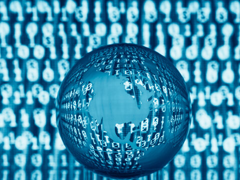 Blue digital globe with binary code overlay on abstract background.