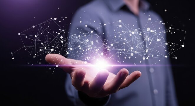 Hands catching sparkling particles in dark space