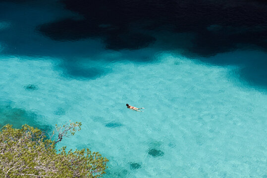 Woman Swimming in the Crystal Clear French Riviera Waters of Calanque d&rsquo;En-Vau During Summer in France