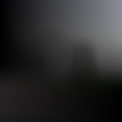 Obraz premium A dark and moody abstract background, with a soft, out of focus, gradient transition from, deep black to, a muted, hazy, gray light source area