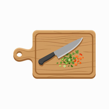 A chef's knife rests on a wooden cutting board next to a pile of chopped vegetables, including carrots, green onions, and parsley.