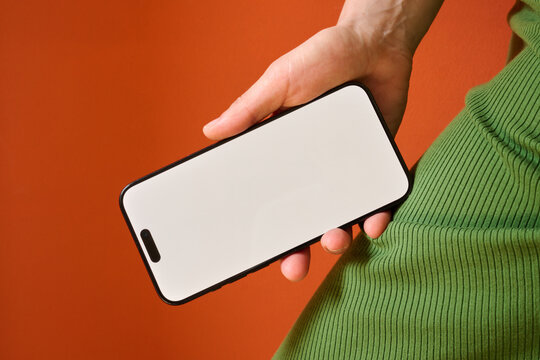Hand holding smartphone