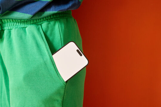 Phone in green pocket