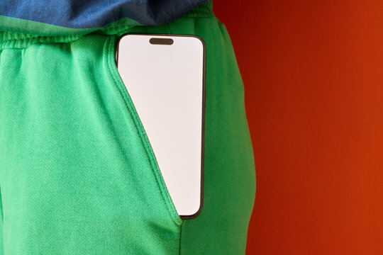 Phone in green pocket