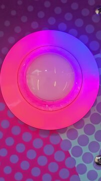pink button lights rainbow color background game, vertical video