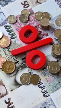 The percentage sign on cash as a concept for inflation, deposits, or tax liabilities. The percentage sign as a financial background for your design