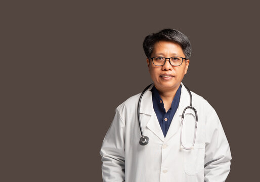 Female doctor standing in white coat with stethoscope