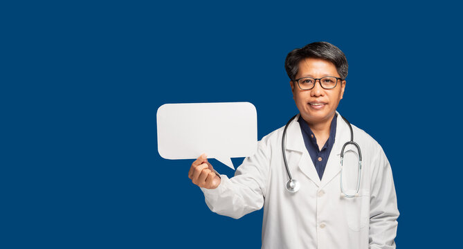 Female doctor holding blank speech bubble sign