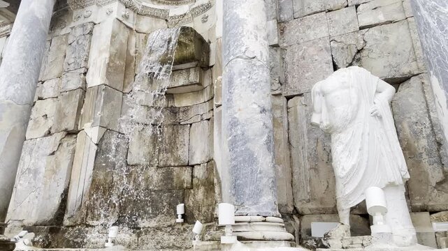 Low Angle Close Up Water Cascading from the Ancient Antonine Fountain Structure at Sagalassos Turkey