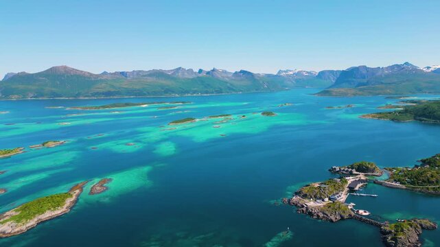 Aerial view of turquoise waters and rocky islands near Hamn i Senja, Norway