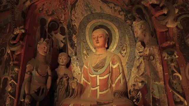 The mural art of the Mogao Grottoes in Dunhuang, China: Ancient Eastern art. Ancient Chinese murals, Mogao Grottoes in Dunhuang, Gansu Province, Buddhist statues, painted sculptures, and mural art.