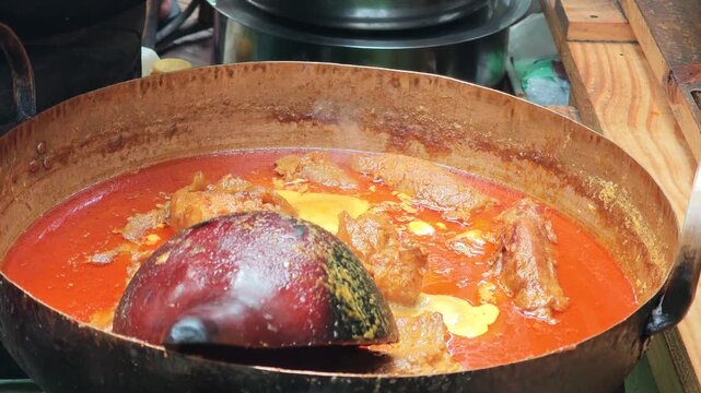 Khao Soi Curry Broth in a Brass Pot