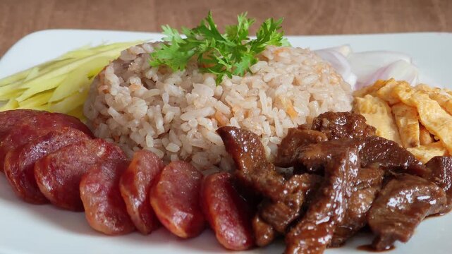Shrimp Paste Fried Rice with Side Dishes on a White Plate