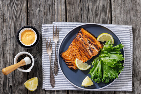 Salmon fillet grilled dinner on wooden background