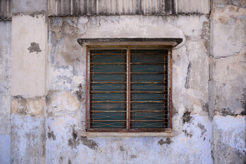 Fototapeta premium Weathered Window on Aged Heritage Wall in Malaysia