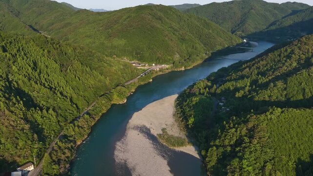 Aerial View of the Niyodo River Winding Through Forested Mountains in Kochi, Japan